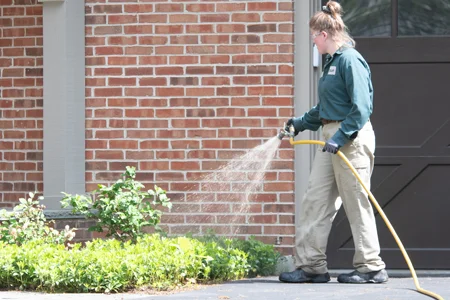 tech spraying mulch beds