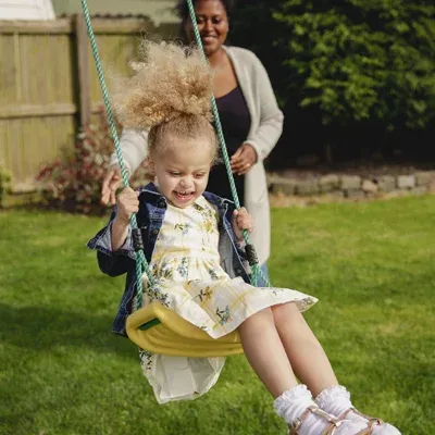 mother daughter playing outside