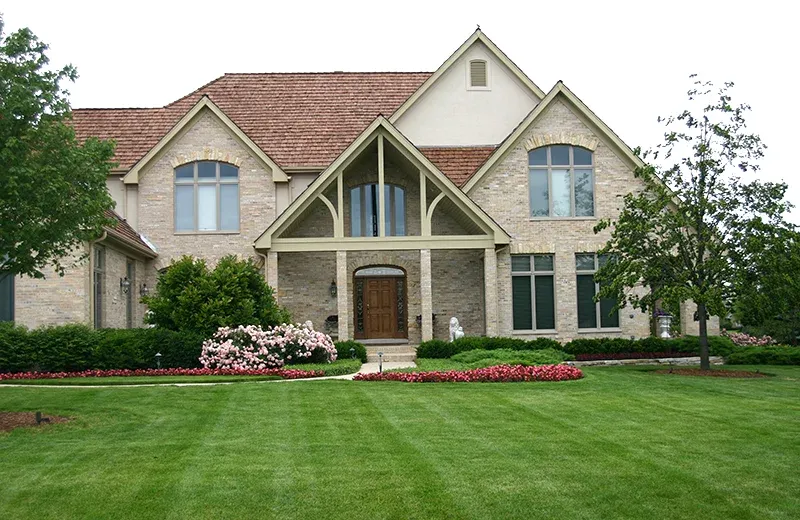 house with green healthy lawn