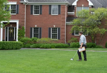 technician measuring yard