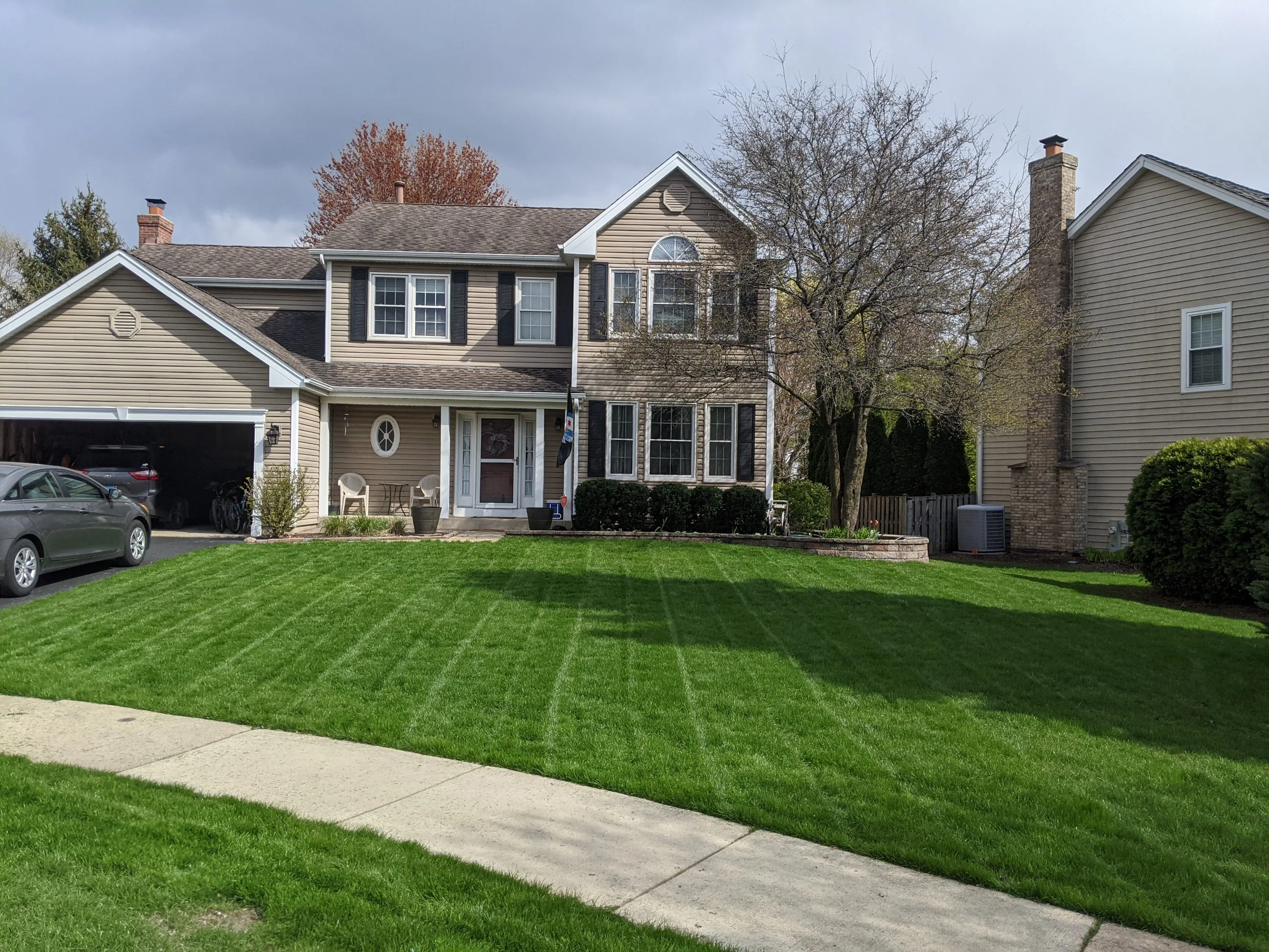 FRONT YARD WITH GREEN GRASS