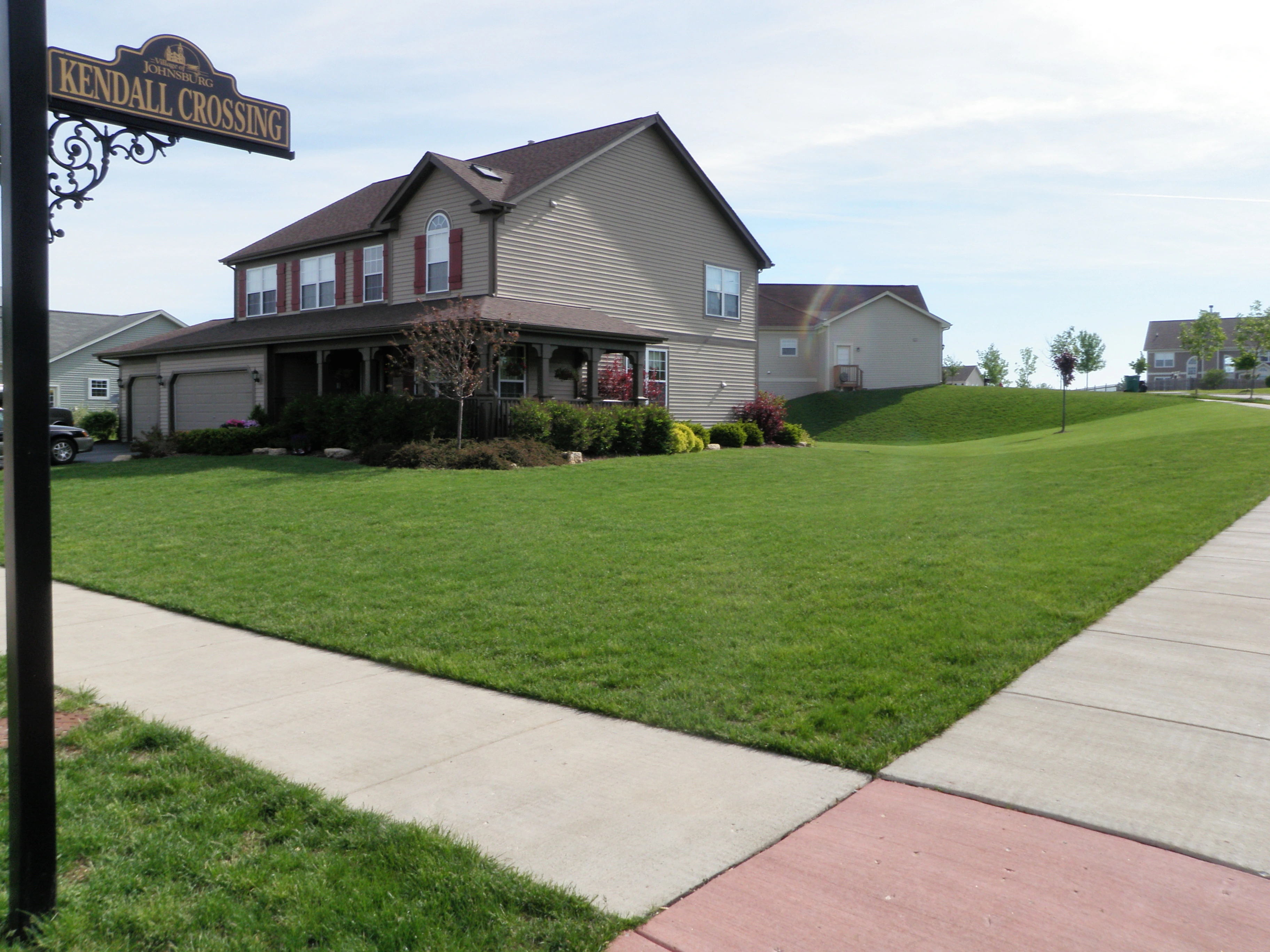 STREET CORNER WITH GREEN GRASS